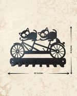 Decorative black metal key holder featuring two cats on a bicycle, stylish wall decor for home entryway by AashiyanaCraft