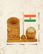 Patriotic wooden pen stand with detailed elephant carving and built-in analog clock for office or study tables.