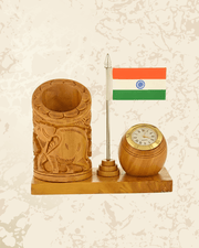 Wooden elephant carved desk organizer featuring an Indian flag, pen holder compartments, and analog clock.