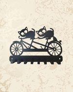 Two cats riding a bicycle black metal wall key holder with multiple hooks by AashiyanaCraft