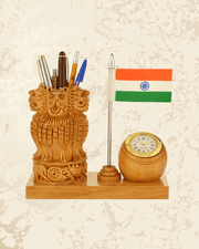 Wooden Ashoka Stambh pen stand with Indian flag design, built-in desk clock, and stationery holder compartments.