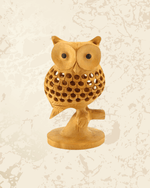 Traditional wooden owl decorative showpiece with intricate handcrafted detailing for home decor.