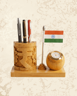 Patriotic wooden desk organizer featuring the Indian flag, pen holder compartments, and a small clock.